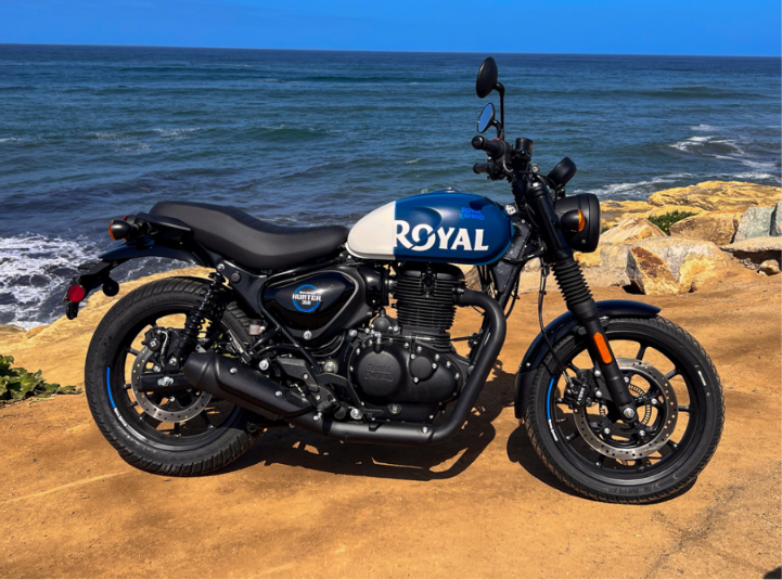 Royal Enfield Hunter 350 parked on a city street showcasing its stylish design, modern features, and sporty look.