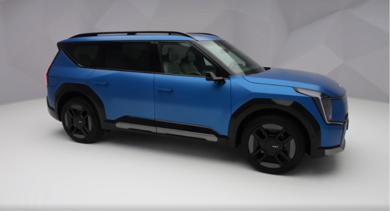 Front three-quarter view of the Kia EV9 premium electric SUV showcasing its bold design and modern styling.